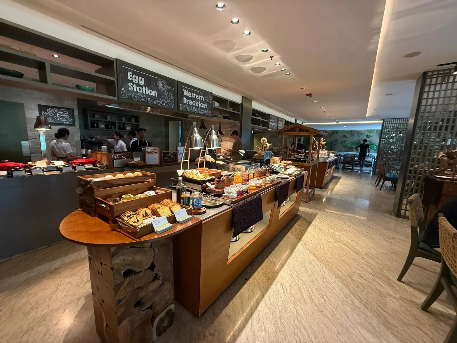 The breakfast buffet, with a pastry counter, an egg station and a western breakfast section