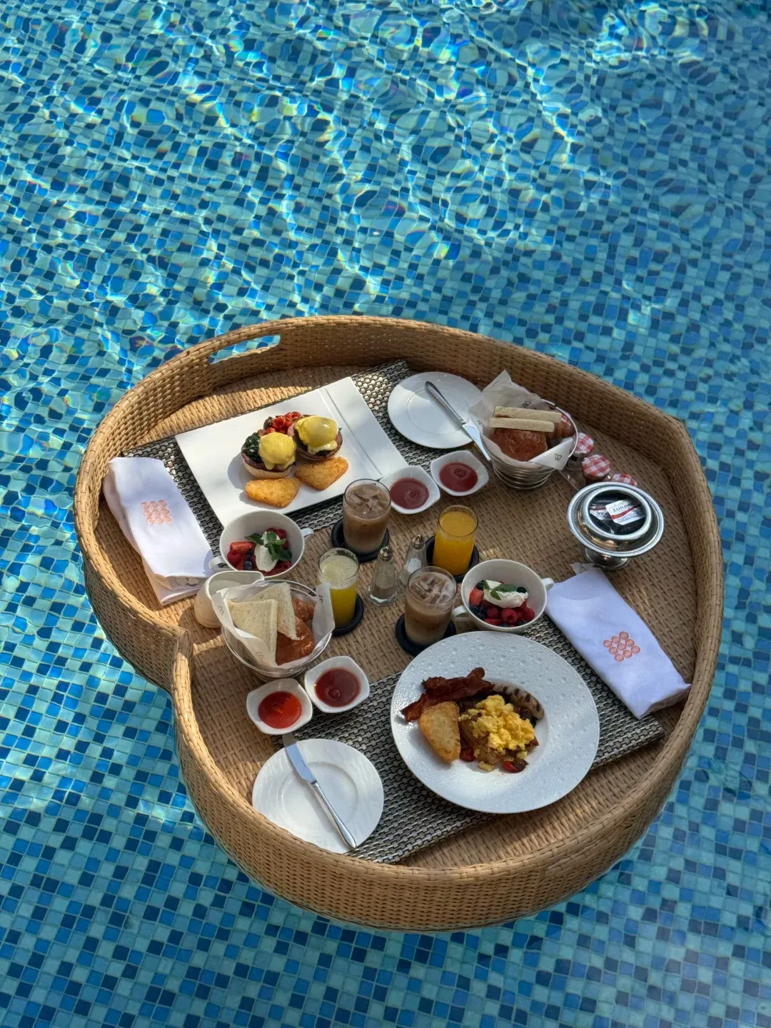 A floating breakfast tray in a pool