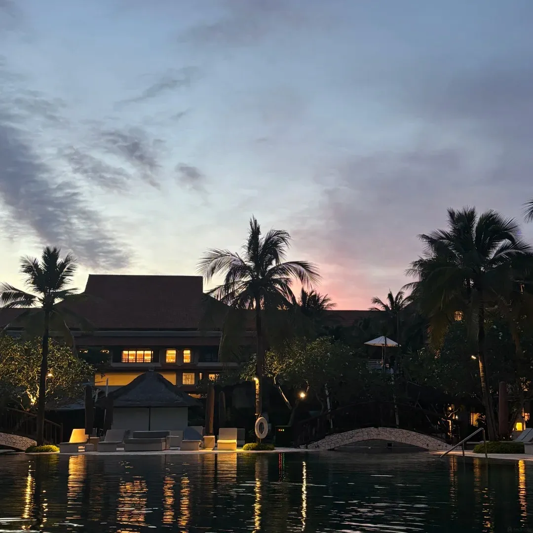 The pool and lobby building at dusk