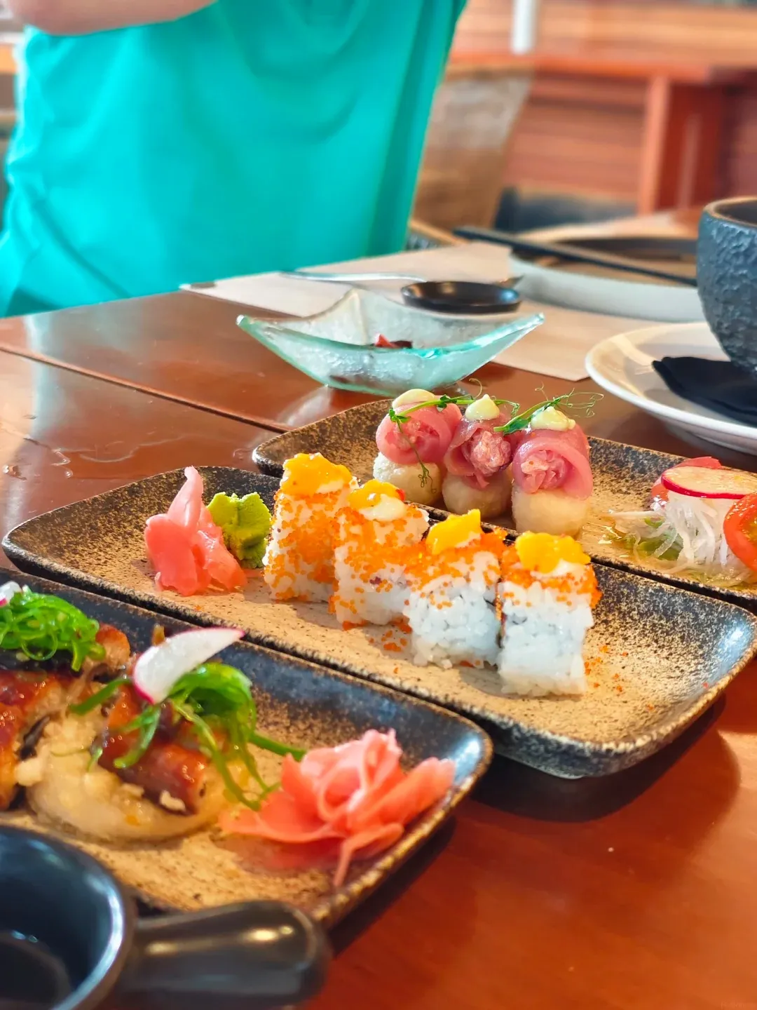Aburi sushi and sashimi plates on a table